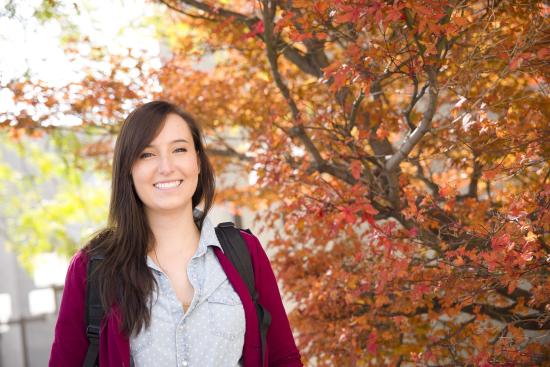 Student outside in the fall