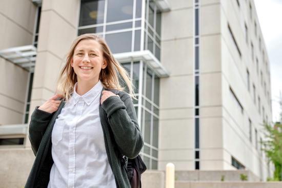 Student outside of the science building