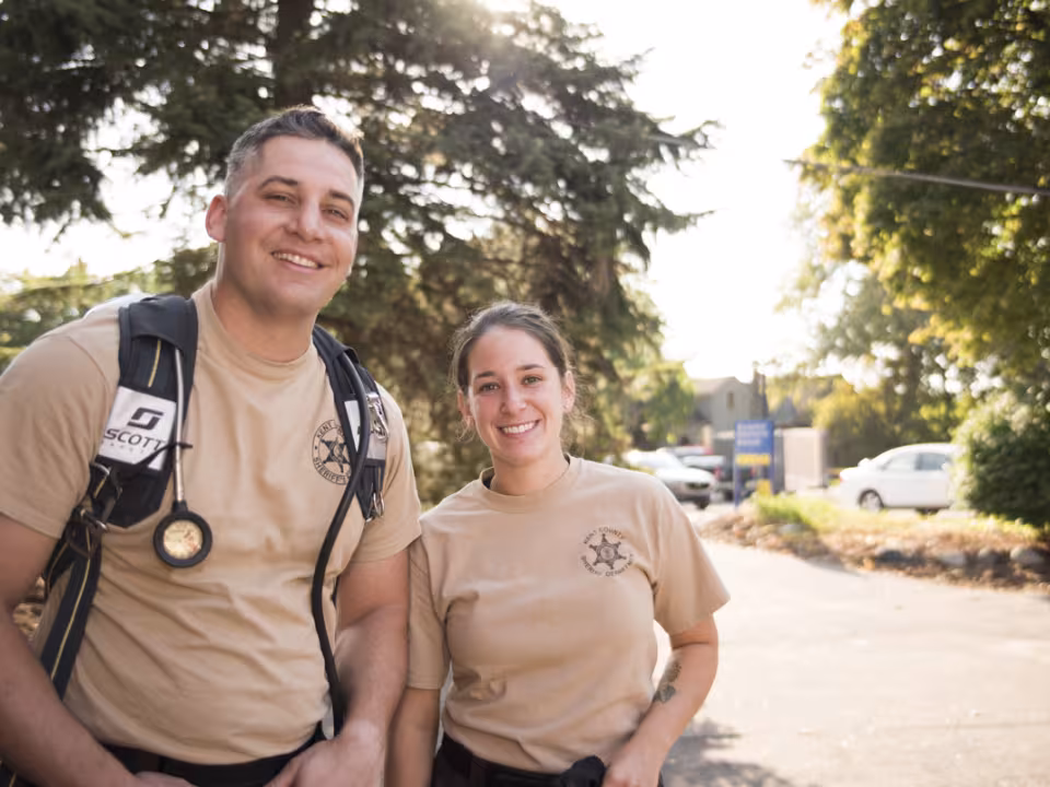 Two Sherriff's academy students standing outside.