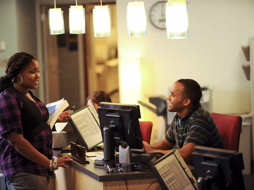 Student receiving help in a service area.
