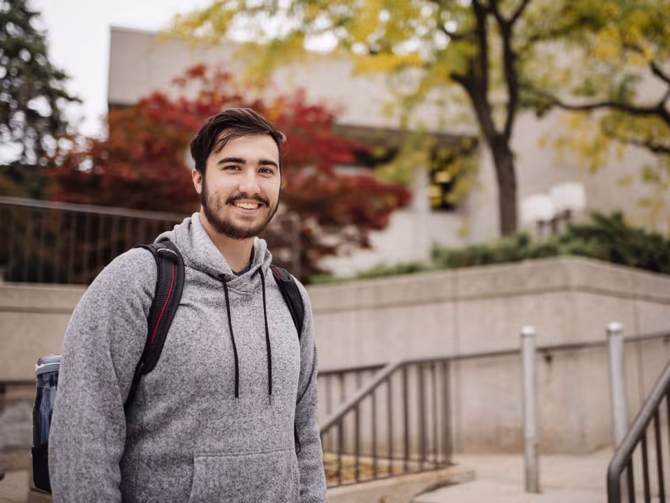 Student smiling confidently into the camera.