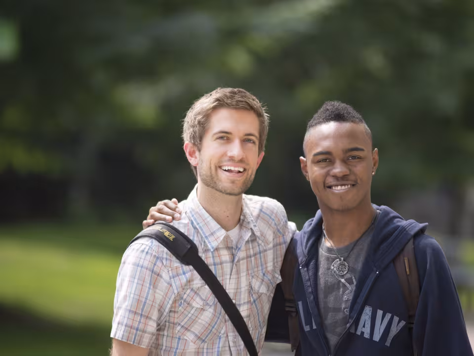 Two students smiling on the DeVos Campus
