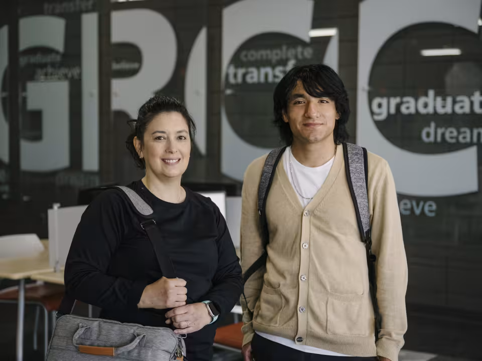 Two students in the Advising center