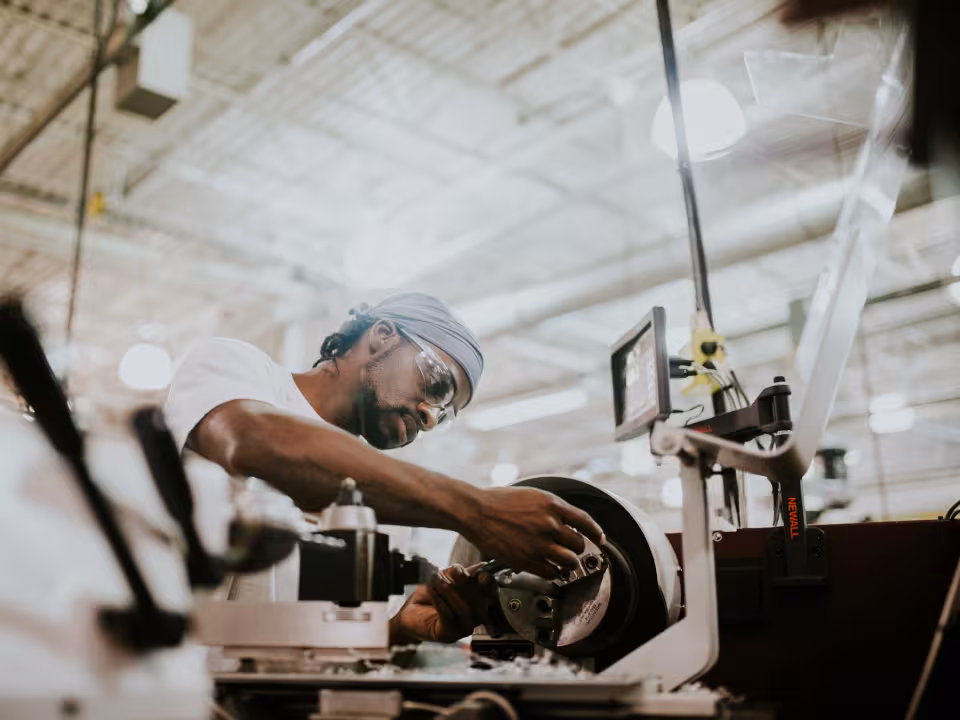 Job Training student works on machinery in the M-TEC.