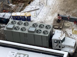 A large piece of HVAC equipment loaded onto a truck.