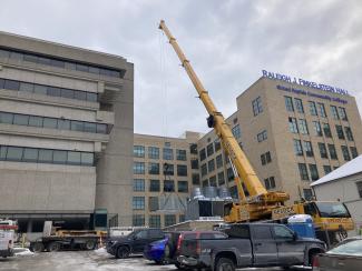 A large crane outside RJF Hall.