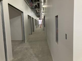 A hallway with finished drywall.