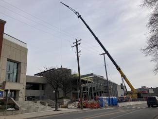 A crane towers over the construction site