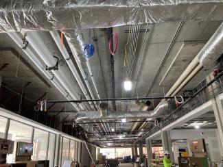 HVAC ductwork in an unfinished ceiling.