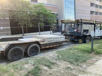 A truck with a flat bed will take the forms away.