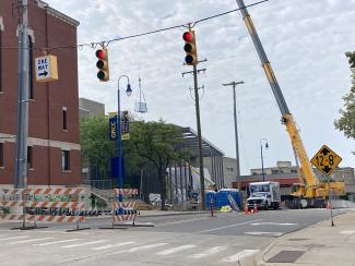 The Gelock crane hoisting HVAC units to the roof