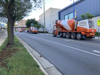 Concrete trucks on Ransom waiting to pour concrete in the Experimental Classroom