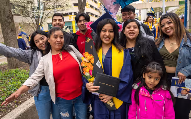 A proud family posing with a graduate!