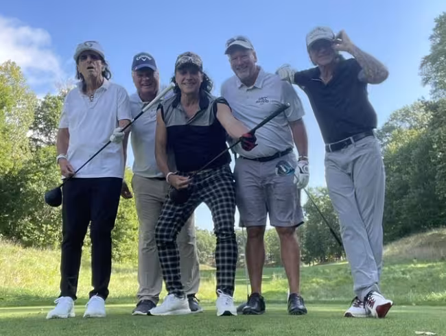 Rocker Alice Cooper with GRCC golf coach John Forton, guitarist Ryan Roxie, coach Mark Rasmussen, and bass player Chuck Garric