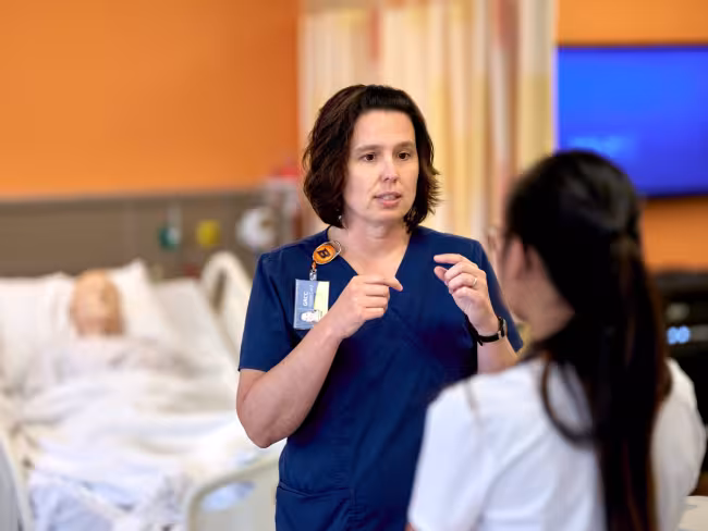 Professor Brandi Miller working with students.