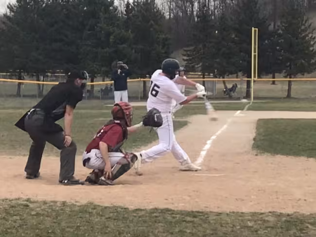 A GRCC batter in action on Saturday.