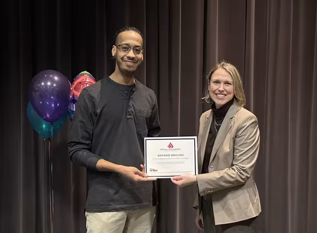 Bayard accepting his award from Malinda Powers.