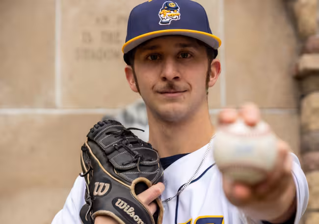 Blake Weibel posing with a ball.