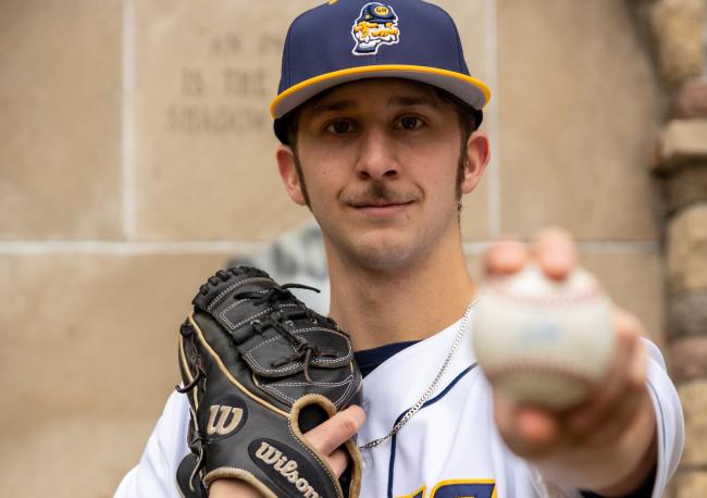 Blake Weibel posing with a ball.