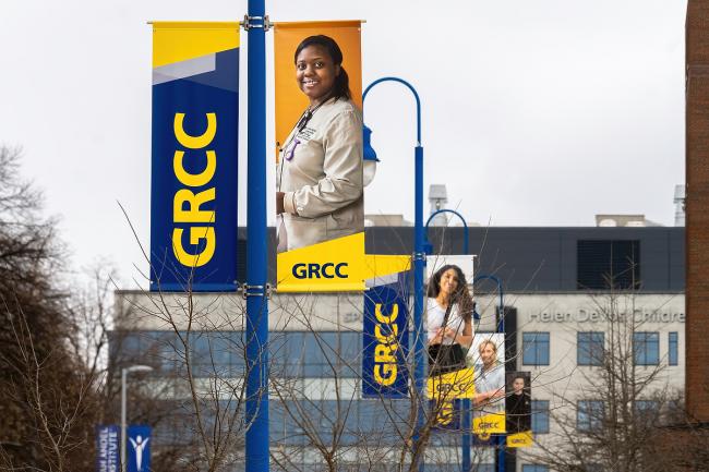 Street pole banners highlighting students on the GRCC campus.