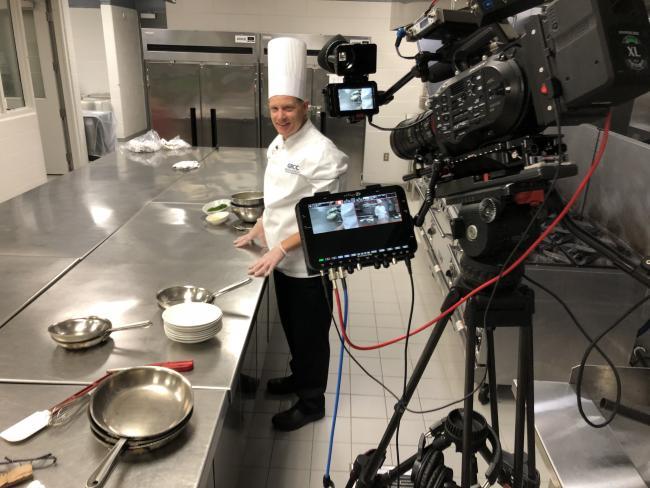 Chef Bob Schultz recording a video of a lesson making sauces.