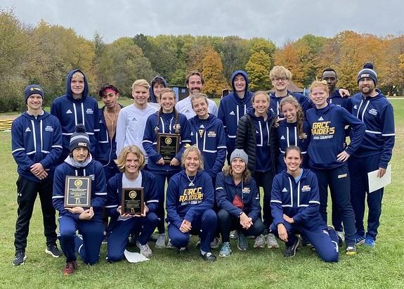 Cross Country teams posing with awards.