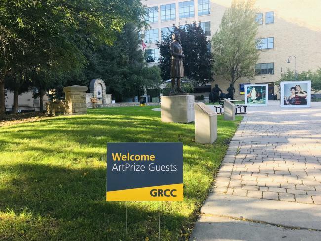 A GRCC yard sign saying Welcome ArtPrize Guests