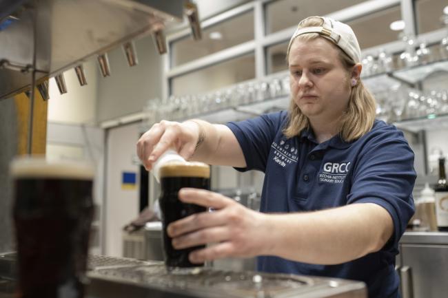 A student working in the GRCC brewery.