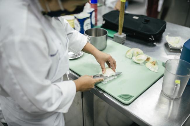 A culinary student preparing a meal.