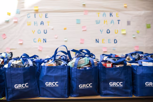 Blue bags of food ready to be distributed to students facing food insecurity.
