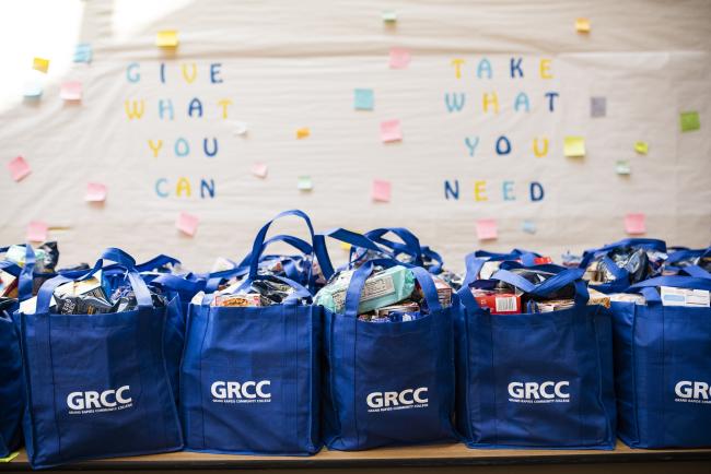 Blue bags of food ready to be distributed to students facing food insecurity.