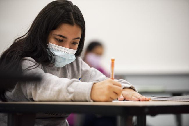 A student working in a pre-algebra classroom.