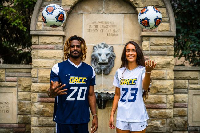 Rico Wade and Audrey Torres modeling the new GRCC soccer uniforms at the iconic lion fountain.