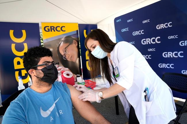 A student getting vaccinated at a GRCC pop-up vaccination clinic.