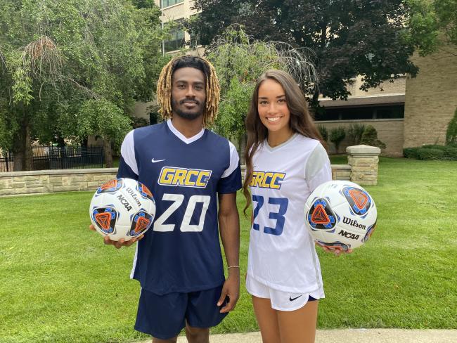 GRCC student-athletes Rico Wade and Audrey Torres with soccer balls.