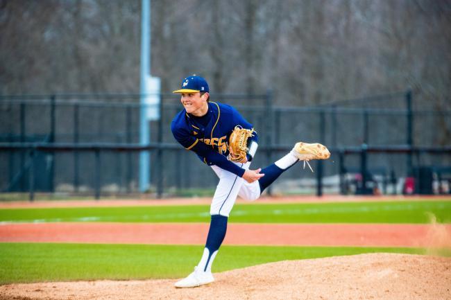 GRCC pitcher in follow through after delivering a pitch.