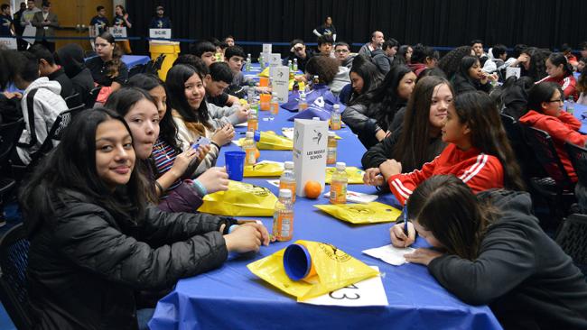 Students sitting at tables during the 2020 Latino Youth Conference