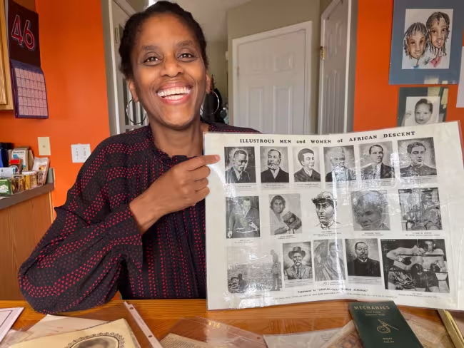 GRCC professor Mursalata Muhammad pointing to a photo of her grandfather.