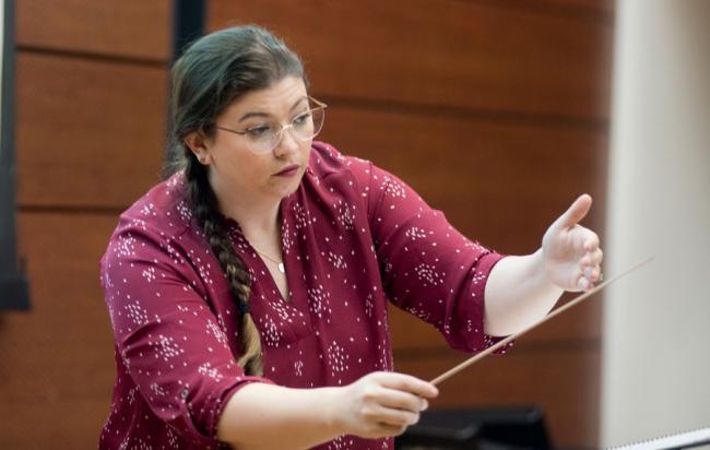 Music director Shannon Shaker conducting during class.