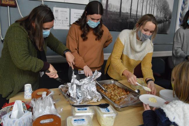 From left, GRCC occupational therapy assistant students Tanya Dyer, Rachel Hill and Taylor Barr serve dinner at Matthew’s House Ministry.