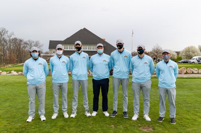 GRCC gold team members posing, wearing face coverings.
