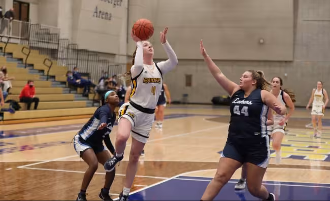 Grace Lodes jumping for a basket.