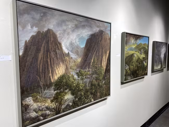 Paintings on display in the gallery.