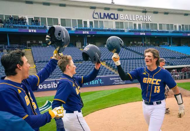 GRCC baseball players celebrating after a home run.