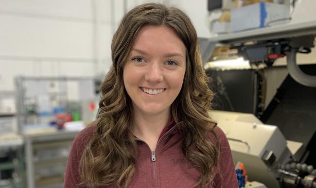 Portrait of Madelynn Pohl in the machining shop.