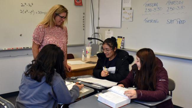 GRCC math tutor Kristine Wright hosts a tutoring session for juniors, clockwise, Annette Gonzolez, Alexsandra Cortez-Torres and Melanie Zapata.