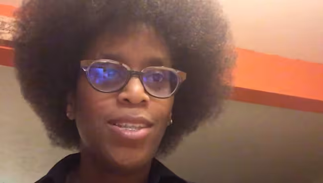 A still from a video of professor Muhammad speaking to her class.
