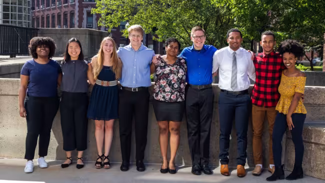 Trevor Beardsley stands fourth from the right in a row of the students in the summer research program.