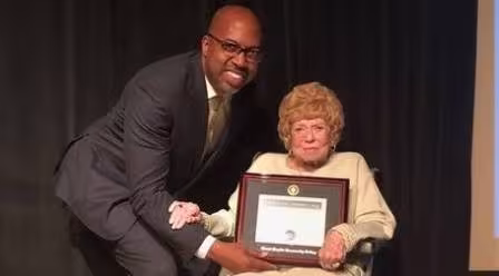 GRCC President Pink presenting Joyce Wisner an honorary degree.