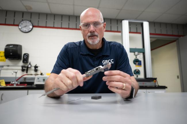 A Quality Science instructor uses precision measuring tools in the classroom..